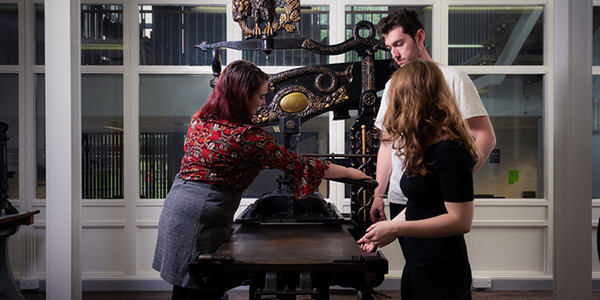 Students using the printing press
