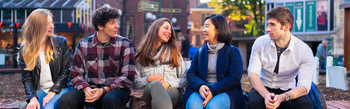 students sitting outside in York city centre