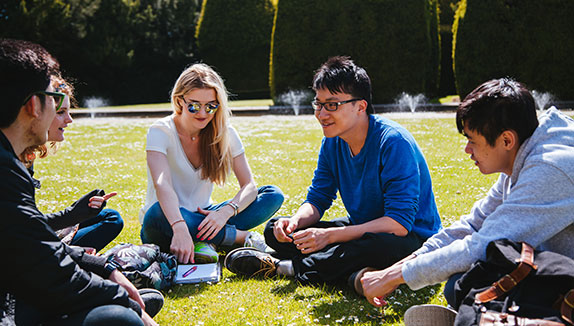 Students relaxing at Campus West in the summer.