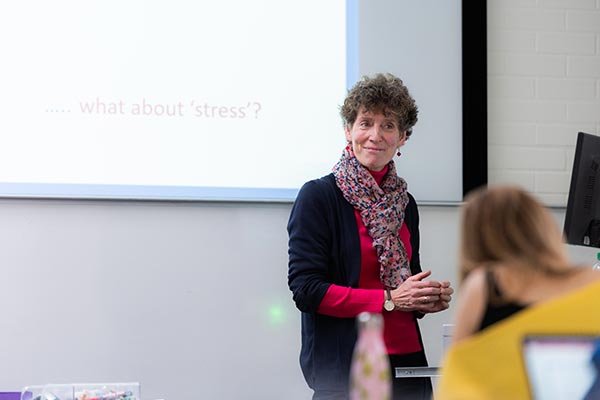 Poppy Nash, a member of staff in the Department of Education, presenting to a group of students.